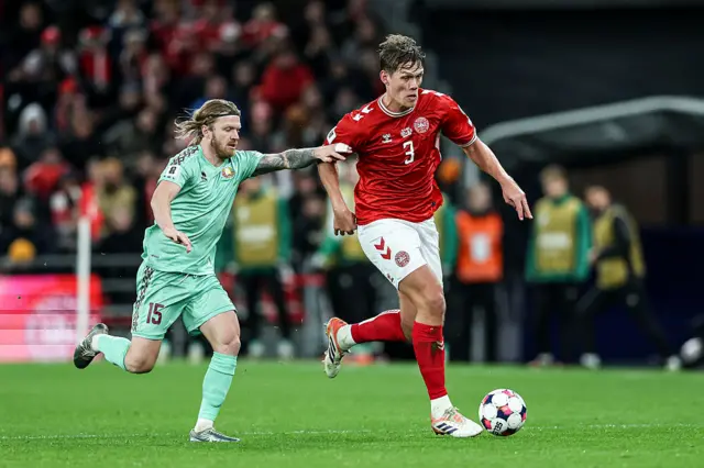 Nikita Korzun of Belarus (L) and Jannik Vestergaard of Denmark