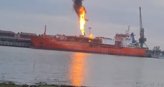 A screengrab from a video filmed on the Romanian side of the Danube showing LPG tanker Ordina on fire