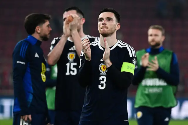 Andy Robertson applauds