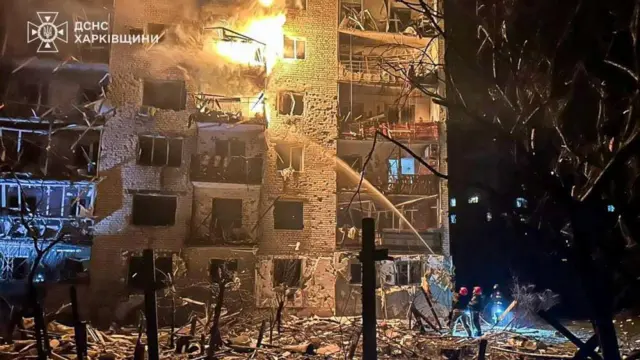 Firefighters seen tackling a blaze at one of the apartment blocks in Balakliya