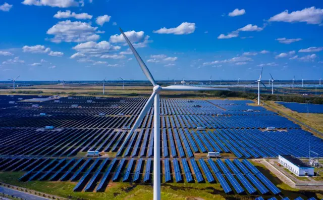 A drone photo shows general view of the solar panels and wind turbines of Wind, Solar and Fishing Base in Dongtai near Yancheng, Jiangsu province, China, 14 October 2020