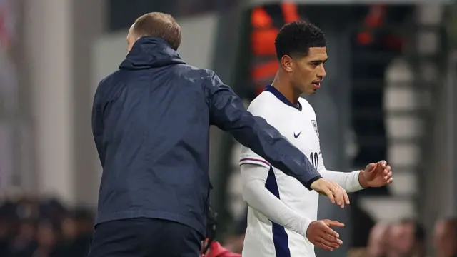 Jude Bellingham shakes hands with Thomas Tuchel after being substituted against Albania.