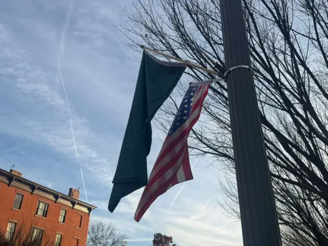 Saudi and US flags on a pole near the White House