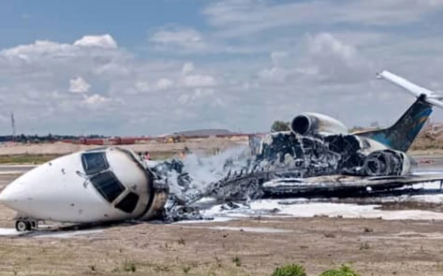 The burnt-out Embraer jet that left the runway in DR Congo and caught fire