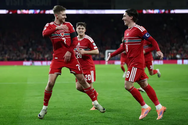 Wales' David Brooks (L) celebrates with Harry Wilson