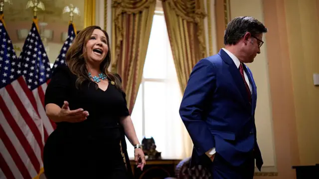 Rep. Adelita Grijalva (D-AZ), accompanied by Speaker of the House Mike Johnson (R-LA), speaks as they depart a ceremonial swearing-in at the U.S. Capitol Building in November