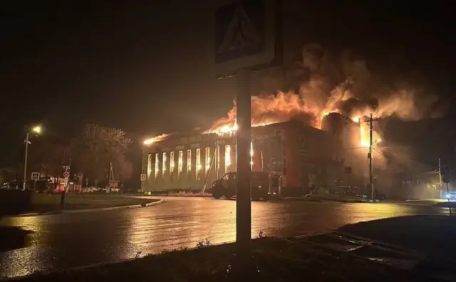 The commercial complex is seen engulfed in flame in this image shared on X