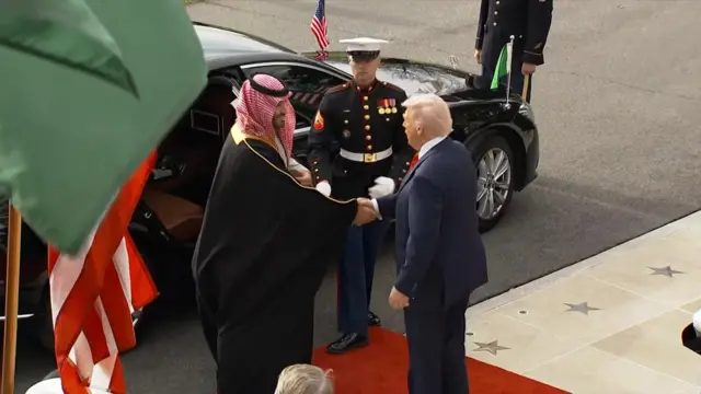 Trump and bin Salman shake hands outside the White House
