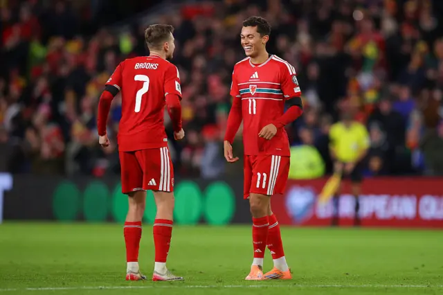 Wales' David Brooks (L) and Brennan Johnson celebrate