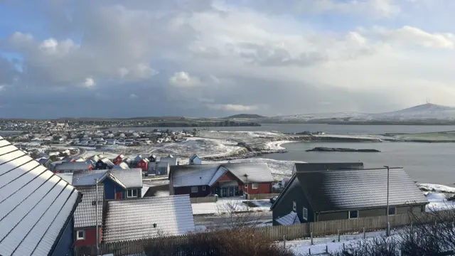 A town with roofs covered in snow