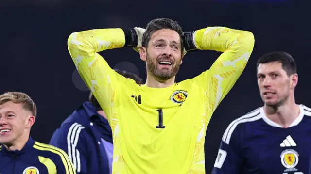 Craig Gordon with his hands on his head and looking overwhelmed.