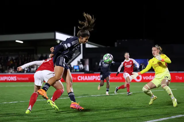 Ball flashes across the Arsenal box