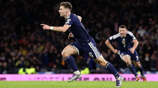Kieran Tierney celebrates after scoring for Scotland