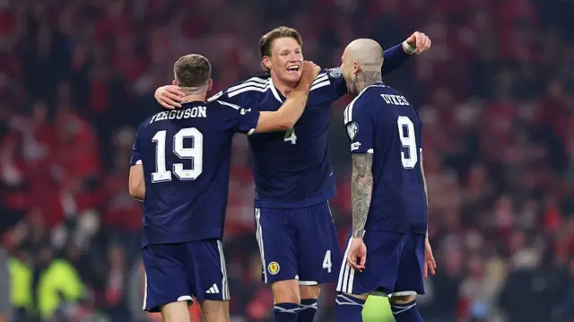 Scott McTominay of Scotland celebrates his team's fourth goal scored by Kenny McLean of Scotland
