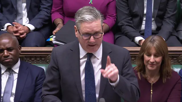 Keir Starmer points his finger while standing at the dispatch box in the House of Commons.