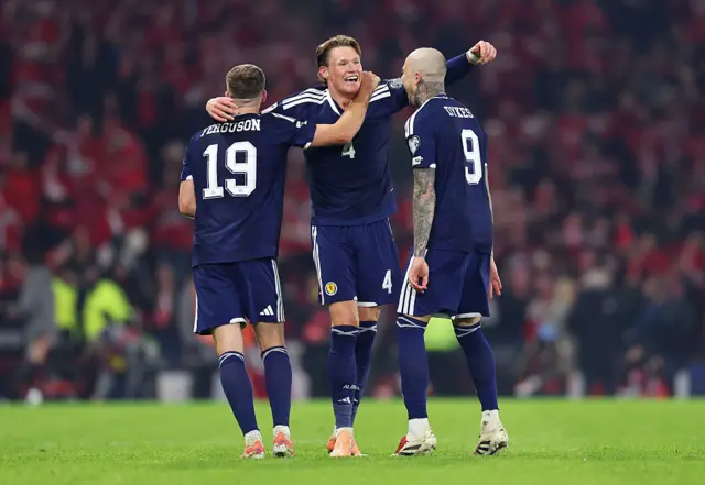 Scott McTominay, Lewis Ferguson and Lyndon Dykes celebrate Scotland's first goal