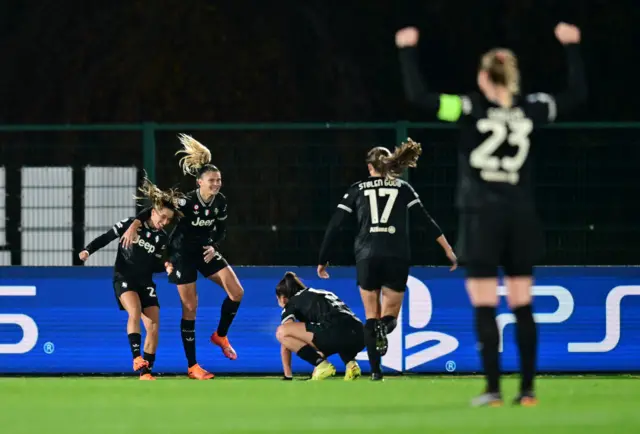Juventus celebrate a goal v Lyon