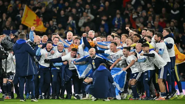 Scotland players celebrate after qualifying for the World Cup