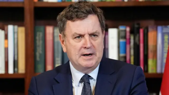 A file photo of Mel Stride speaking in front of a bookcase