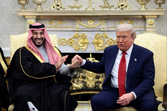 US President Donald Trump and Saudi Crown Prince and Prime Minister Mohammed bin Salman hold hands during a meeting in the Oval Office at the White House