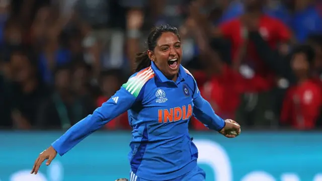 Harmanpreet Kaur celebrates taking the match-winning catch