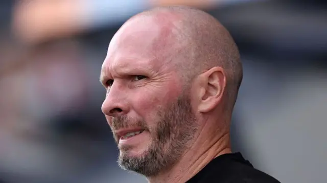 Michael Appleton looks on from the dugout while manager of Shrewsbury.