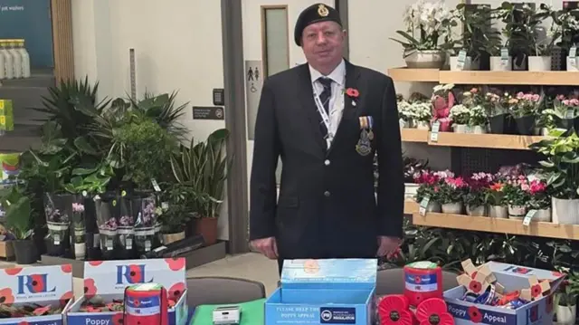 LNER train driver Andrew Johnson pictured at a Royal British Legion stall