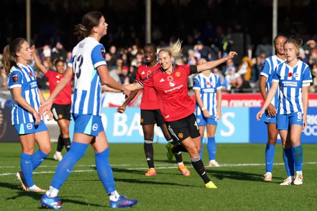 Manchester United's Lisa Naalsund celebrates scoring their side's third goal of the game during the Barclays Women's Super League match at Broadfield Stadium, Crawley.