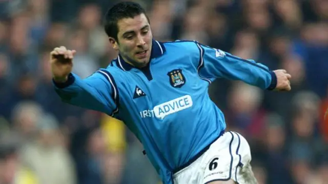 Kevin Horlock playing the ball with his left foot for Manchester City.