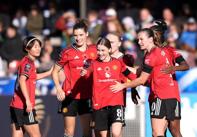 Manchester United's Jess Park (centre right) celebrates scoring their side's second goal of the game during the Barclays Women's Super League match at Broadfield Stadium, Crawley.