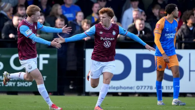 South Shields' Luke Woolston (centre) celebrates after scoring
