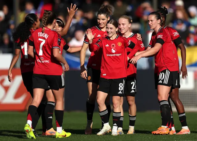 Jess Park of Manchester United celebrates scoring her team's second goal with teammates Ella Toone and Elisabeth Terland during the Barclays Women's Super League match between Brighton & Hove Albion and Manchester United