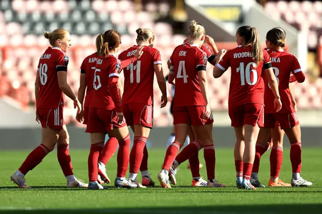 Beata Olsson of Liverpool (obscured) celebrates with teammates after scoring her team's first goal during the Barclays Women's Super League match between Tottenham Hotspur and Liverpool at Brisbane Road