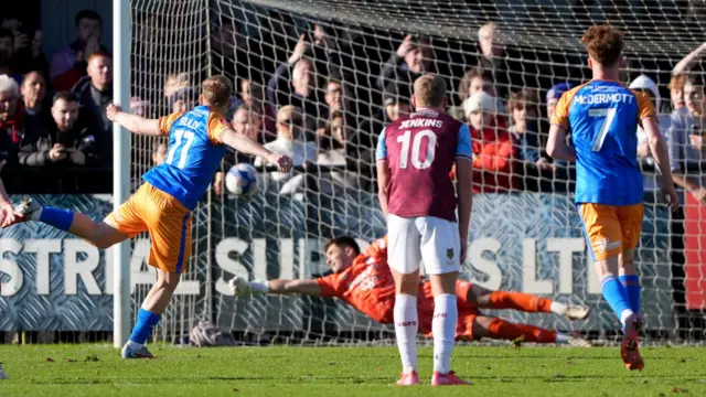 Anthony Scully scores a penalty for Shrewsbury Town