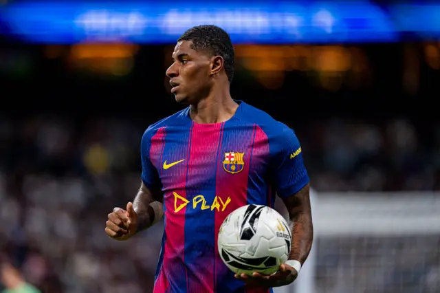 Marcus Rashford holding the match ball
