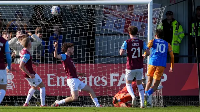 Shrewsbury Town's Tom Sang (right) scores