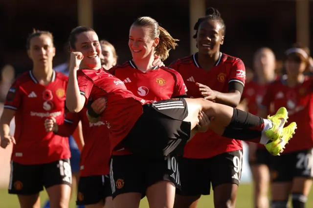 Manchester United's Elisabeth Terland celebrates scoring their first goal with Ella Toone.