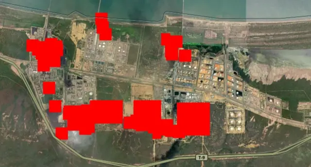 Red rectangles superimposed on a satellite image of the oil refinery showing multiple heat sources