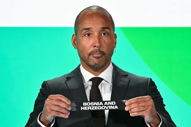 Sweden former player Martin Dahlin shows the paper slip of Bosnia and Herzegovina during the 2026 FIFA World Cup European Play-Off draw