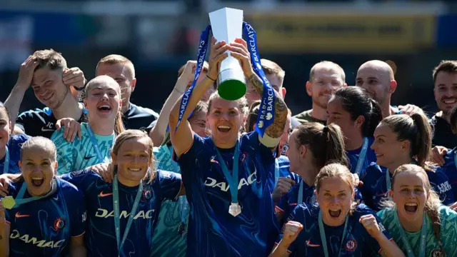 Chelsea Captain Millie Bright lifts the WSL trophy