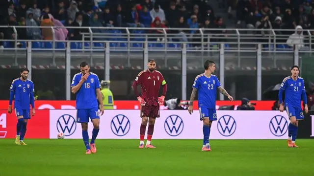 Italy players react after defeat to Norway.
