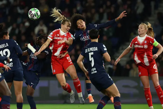 Bayern and PSG players go up for a header