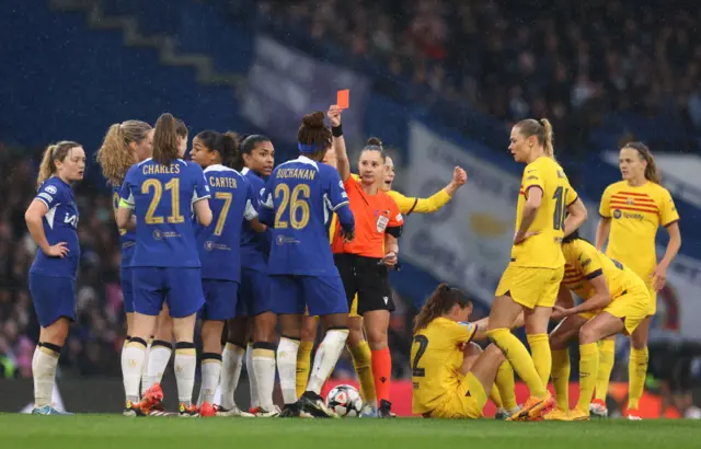 Kadeisha Buchanan of Chelsea is shown a red card