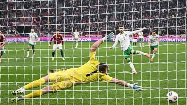 Troy Parrott scores for Republic of Ireland against Hungary.