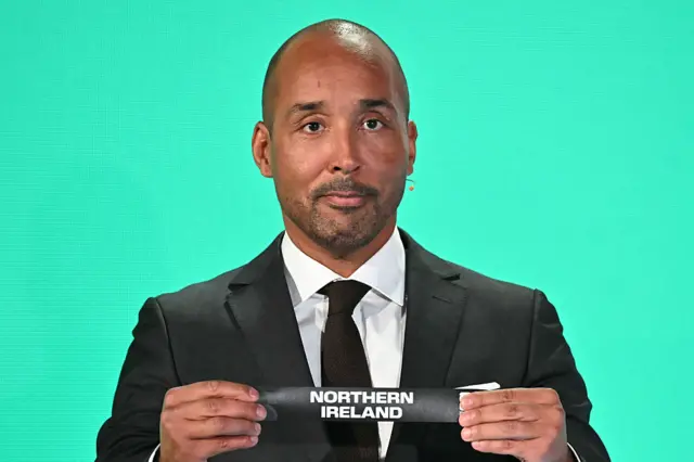 Sweden former player Martin Dahlin shows the paper slip of Northern Ireland during the 2026 FIFA World Cup European Play-Off draw