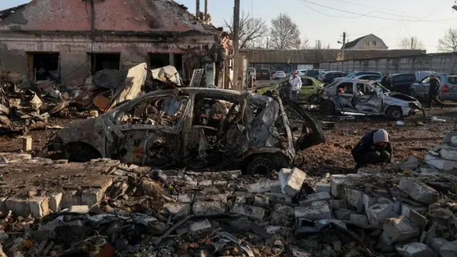 devastated land including demolished car in Odesa, Ukraine