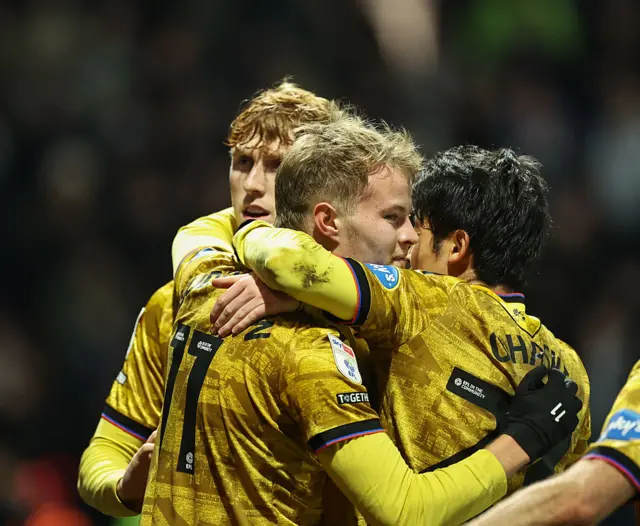 Blackburn Rovers' Andri Gudjohnsen celebrates scoring his side's second goal with Yuki Ohashi and George Pratt