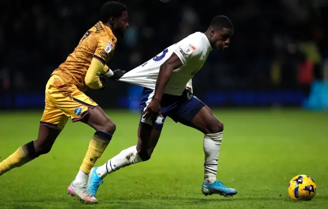 Blackburn Rovers' Ryan Alebiosu (left) pulls back on Preston North End's Thierry Small