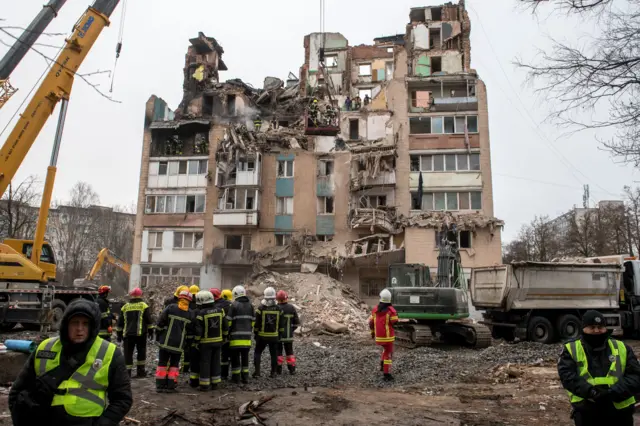 Ukrainian rescuers work at the site of a Russian strike on a high-rise residential building in Ternopil
