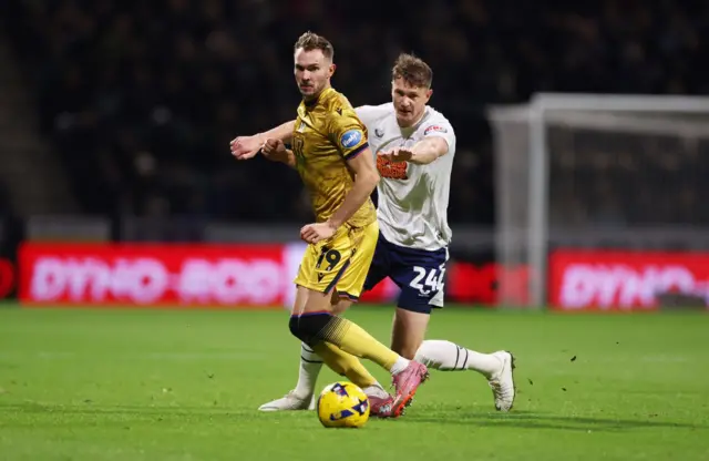 Ryan Hedges of Blackburn Rovers is challenged by Michael Smith of Preston North End
